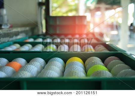Plastic golf ball in the basket waiting for someone to play