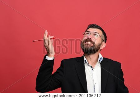 Man In Classic Outfit With Beard Holds Red Marker