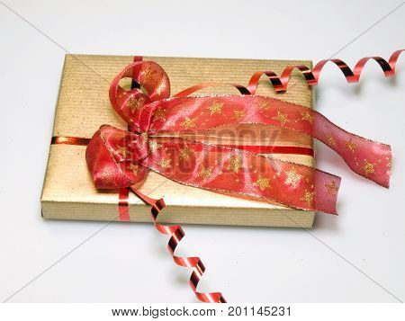 Present wrapped in gold and red with big bowl