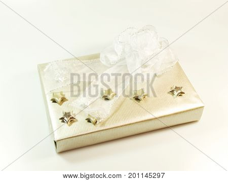 Gift wrapped in silver paper with stars and bowl