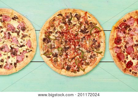 Pizza on wooden table top view. Fast food Delicious. Post blog social media. View from above with copy space. Banner template layout mockup top view on pizza. Pizza ready to eat.