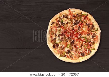 Pizza on wooden table top view. Fast food Delicious. Post blog social media. View from above with copy space. Banner template layout mockup top view on pizza. Pizza ready to eat.