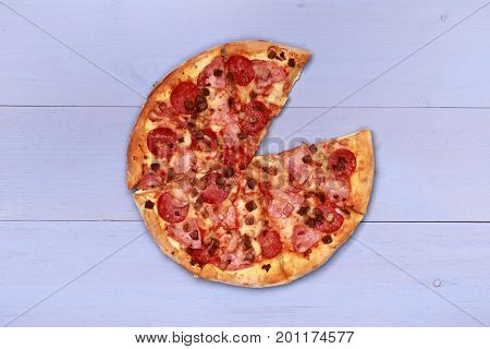 Pizza on wooden table top view. Fast food Delicious. Post blog social media. View from above with copy space. Banner template layout mockup top view on pizza. Pizza ready to eat.