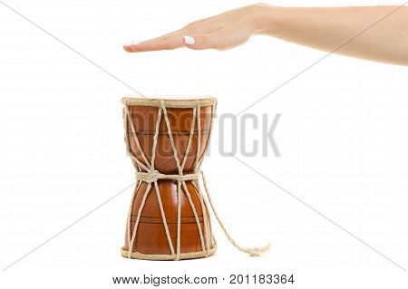 Female hands little drum on white background isolation