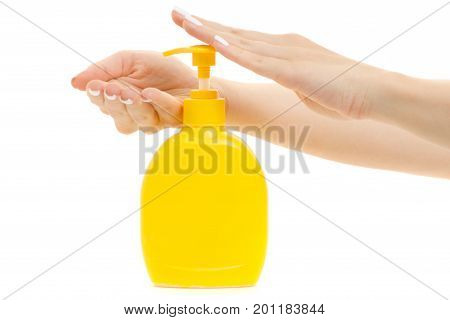 Female hands with a dispenser on a white background isolation