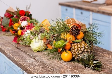 Original compositions of fuits in bouquets. Fruits and vegetables prettily wrapped in bouquets.
