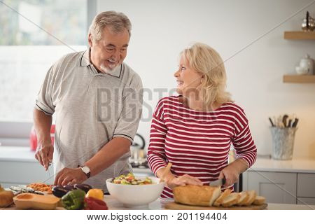 Senior couple preparing meal