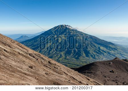 Green Merbabu Mountain From Merapi Mountain Slope At Java Island In Indonesia.
