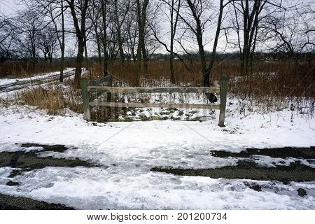 A split rail fence along the Rock Run Greenway Trail, which runs through the Rock Run Preserve in Joliet, Illinois, during January.