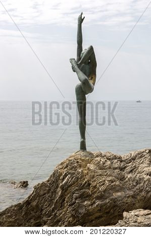 BUDVA, MONTENEGRO - AUGUST 03, 2017:Sculpture "Dancer from Budva" on the beach in Budva Montenegro.