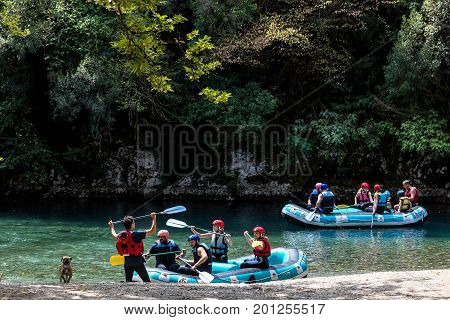 Adventure Team Doing Rafting Of The Voidomatis River In Zagori