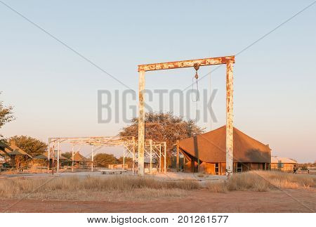 ETOSHA NATIONAL PARK NAMIBIA - JUNE 26 2017: Structures of an old elephant abattoir at the Olifantsrus Rest Camp in the Etosha National Park at sunrise