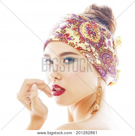 young pretty modern girl with bright shawl on head emotional posing isolated on white background, asian people ethnicity close up
