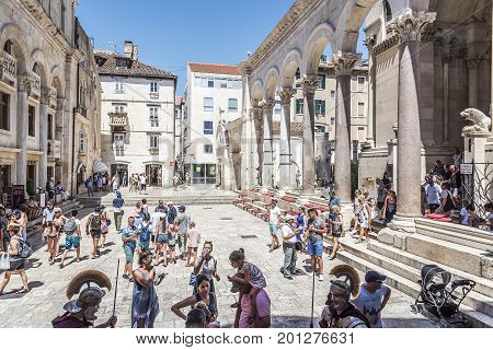 SPLIT, CROATIA - JULY 12, 2017: Tourists on the square Peristil in Diocletian's palace.
