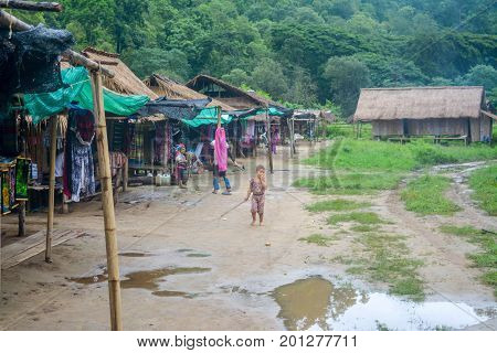 CHIANG MAI, THAILAND - July 10, 2017: Karen hill-tribe (Long Neck) woman weaving fabrics for a living at her house.