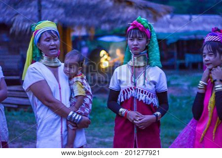 CHIANG MAI, THAILAND - July 10, 2017: Karen hill-tribe (Long Neck) woman weaving fabrics for a living at her house.