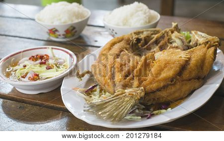 stir fried fish with rice and thai style sauce