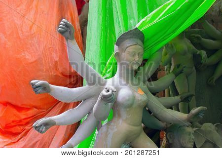 KOLKATA WEST BENGAL INDIA - 25 SEPTEMBER 2016: Clay idol of Goddess Durga under preparation for "Durga Puja' festival in Kumartuli Kolkata. Biggest festival of Hinduism.