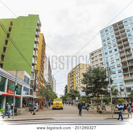 People Walking Between The Downtown Shops In Londrina