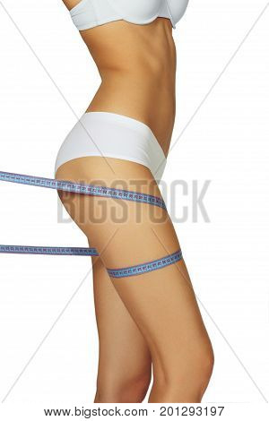 Slimming woman in panties with blue measures