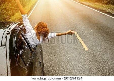 Asian women travel relax in the holiday. driving a car traveling happily.