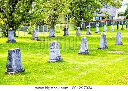 Ile D'Orleans Canada - June 1 2017: Cemetery and gravestones in summer