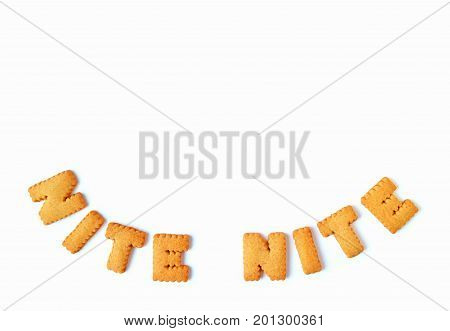 Top view of the word NITE NITE, made with alphabet shaped biscuits on white background, with free space for design and text