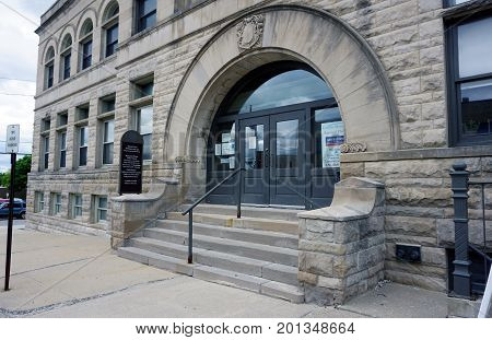 CADILLAC, MICHIGAN / UNITED STATES - MAY 31, 2017: 
The old Cadillac City Hall building houses the Cadillac Area Visitors Bureau, Community Foundation, Congressman John Moolenaar's Office, the Stehouwer Free Clinic, and the Mid-Michigan Library League.
