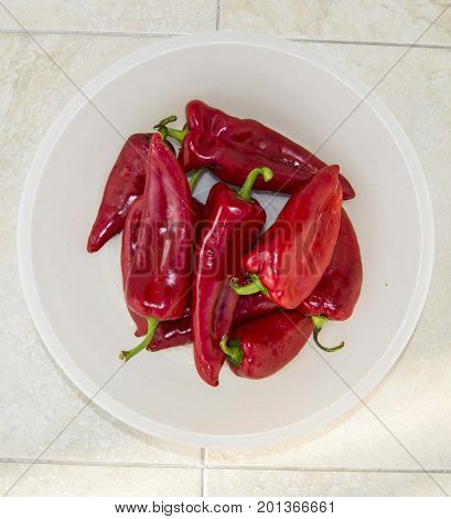 Red Hot Chili Peppers on white background 
 capia peppers in the plate