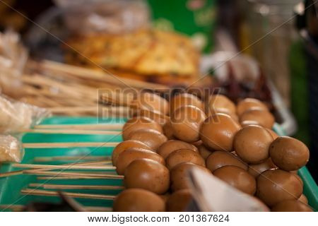 an egg sate angkringan street food brown color java