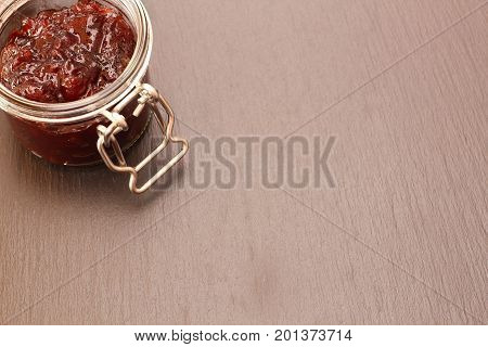 Jam in jar glass on black background
