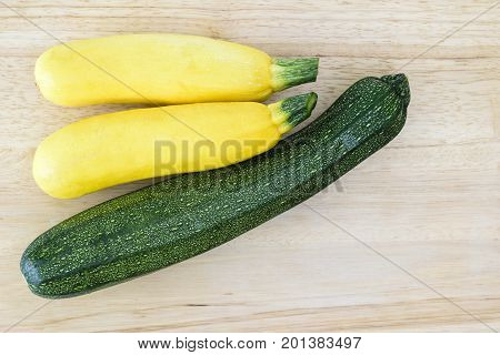 Green and Yellow Zuchini on a cutting board