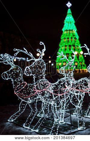 Lighting Decoration Deers With Christmas Tree On The Background In The City Of Gomel During New Year