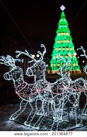 Lighting Decoration Deers With Christmas Tree On The Background In The City Of Gomel During New Year