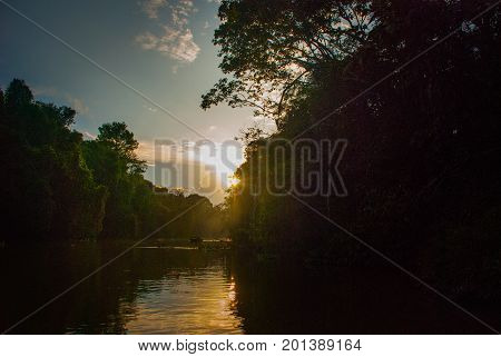 Kinabatangan River, Rainforest Of Borneo Island, Sunset. Sabah Malaysia