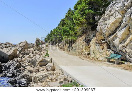 Concrete path by the sea. Photographed in the summer.