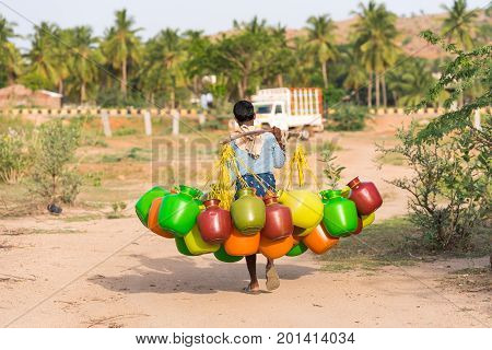 Indian Man Goes For Water, Puttaparthi, Andhra Pradesh, India. Copy Space For Text.