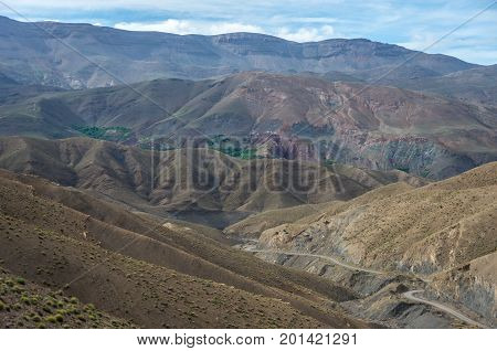 Panorama Of High Atlas Mountain Range And Serpentine Road From On Of Pass, Morocco, Africa