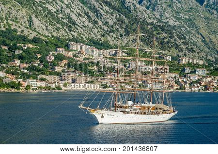 Kotor Montenegro - June 8 2017: A four-masted sailing vessel (sailing cruise liner) Sea Cloud moving into the port of Kotor.