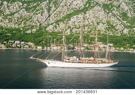Kotor Montenegro - June 8 2017: A four-masted sailing vessel (sailing cruise liner) Sea Cloud moving into the port of Kotor.