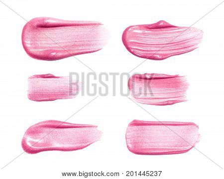 Set of different lip glosses smear samples isolated on white. Smudged makeup product sample.