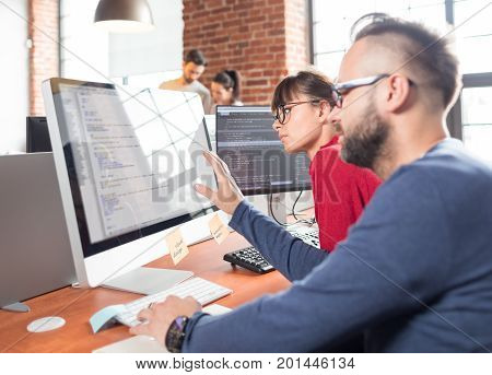 Developing programming and coding technologies. Website design. Programmer working in a software develop company office.