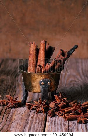 Metal dish with anise and cinnamon stics