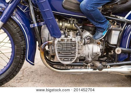 detail of the old blue motorcycle radiator chrome elements close-up