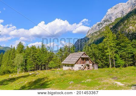 Mountain cabin, hut in European Alps, located in Robanov kot, Slovenia, popular hiking and climbing place with picturescue view