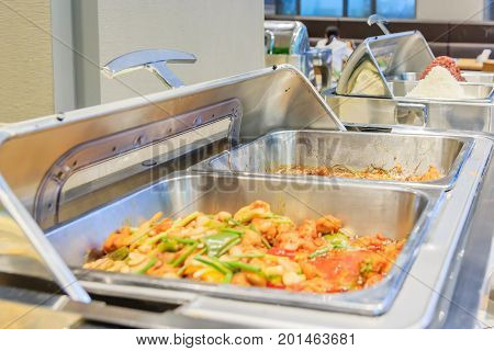 Cuisine Culinary Buffet Dinner Catering Dining Food Celebration Party Concept. Different variety of food in all you can eat catering buffet food indoor in luxury restaurant with meat and vegetables