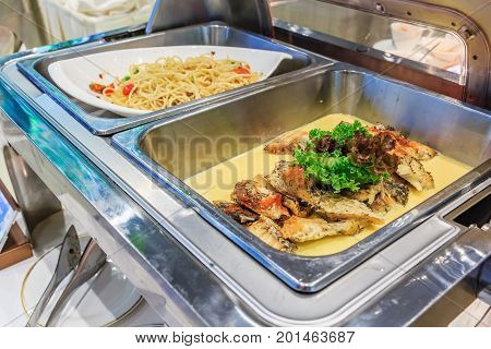 Cuisine Culinary Buffet Dinner Catering Dining Food Celebration Party Concept. Different variety of food in all you can eat catering buffet food indoor in luxury restaurant with meat and vegetables