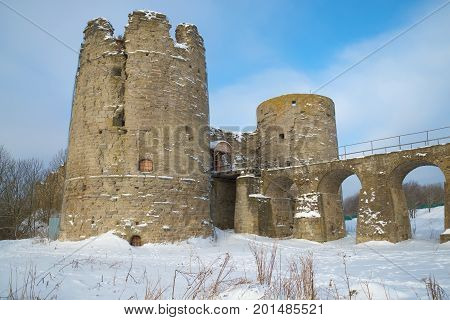 At medieval Koporsky fortress in the snow February afternoon. Koporye, Leningrad Region, Russia