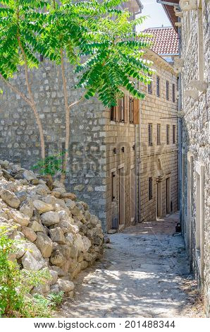 Old narrow street in Stari Grad of Ulcinj Montenegro. The fortress in the Old town in a sunny summer day.