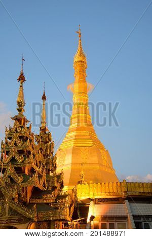 Chedi f the Sule pagoda close up in the evening twilight. Yangon, Burma